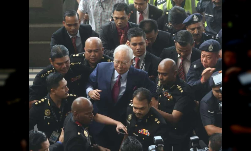 Najib escorted