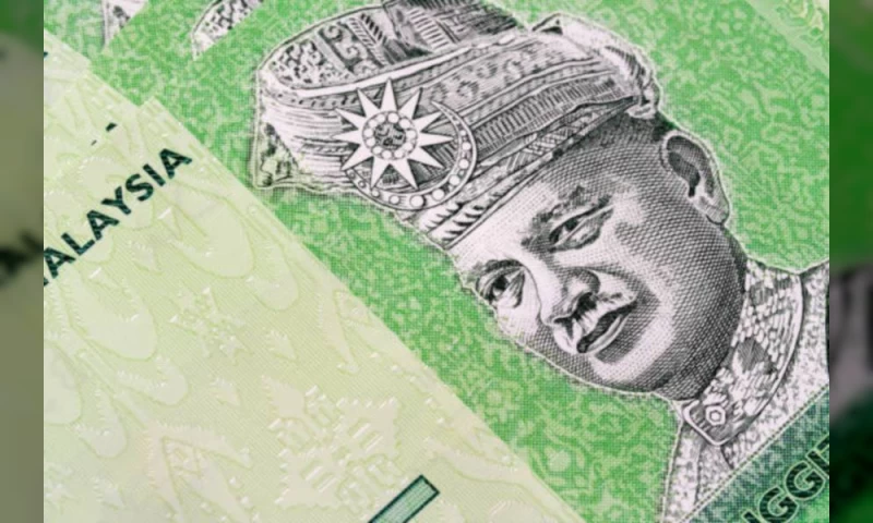 Ringgit Breaks Past RM4.14 Against US Dollar for First Time Since November 2021